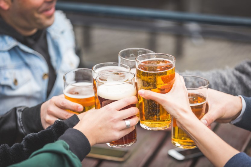 Group of friends enjoying a beer at pub in London