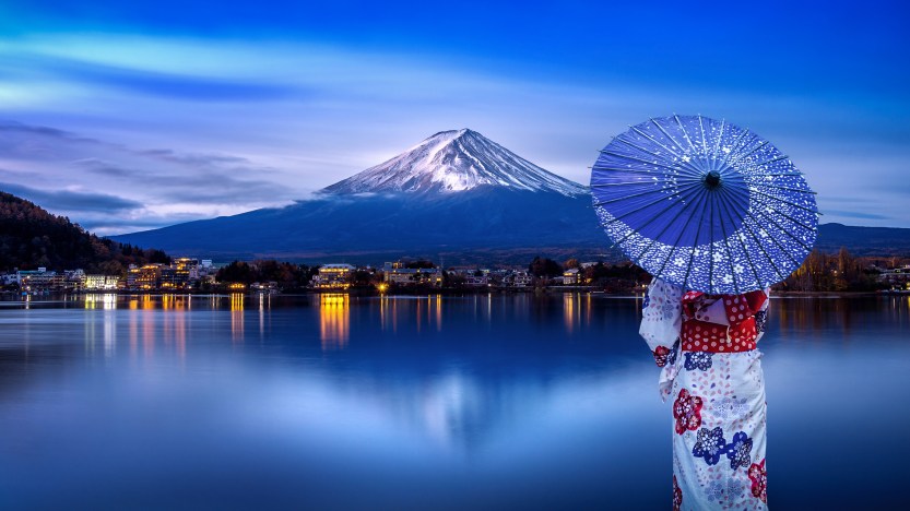 Asian woman wearing japanese traditional kimono at Fuji mountain, Kawaguchiko lake in Japan.